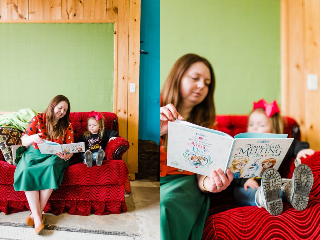 Owner of Sundrop Books reading a Frozen book to a young girl on a red couch.