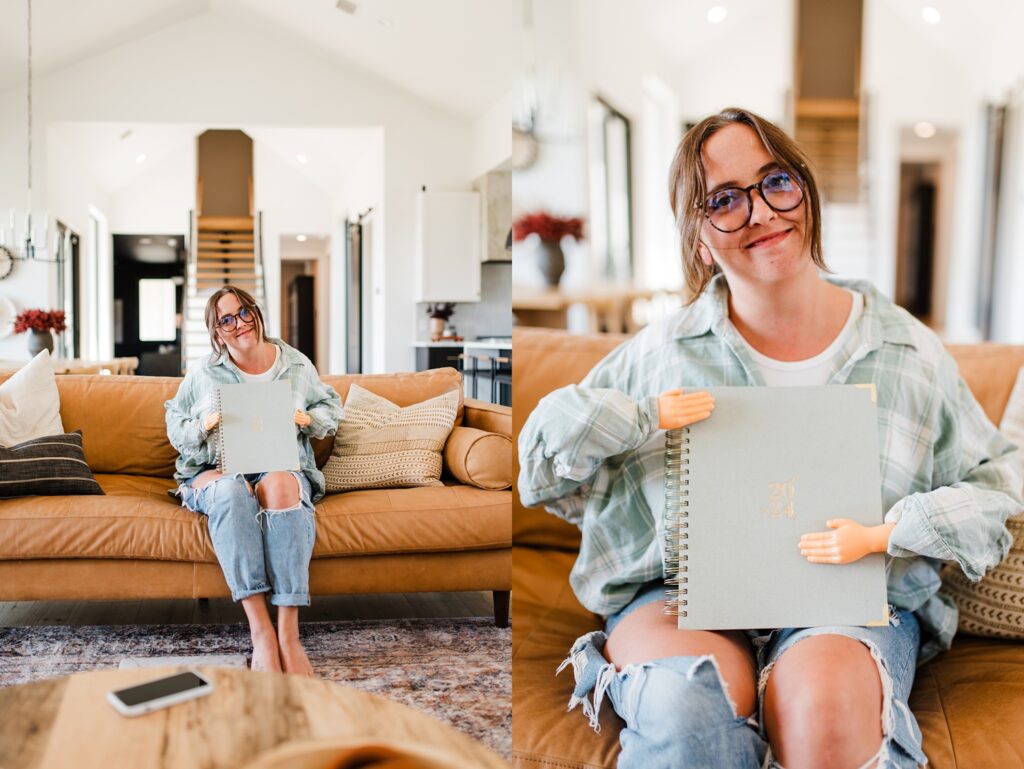 woman using tiny hands to hold a planner