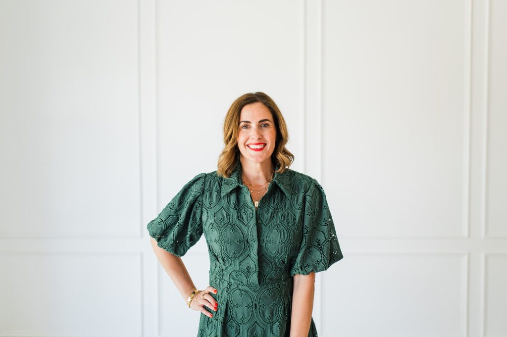 Brand photo of woman in green dress smiling