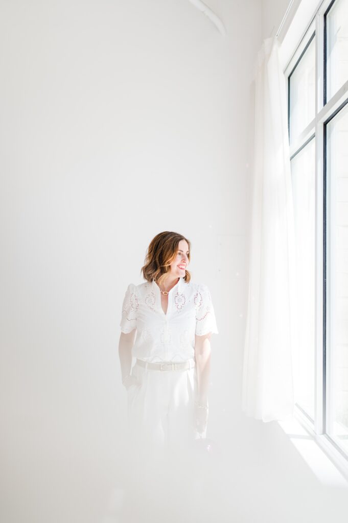Brand photo of woman surrounded by white