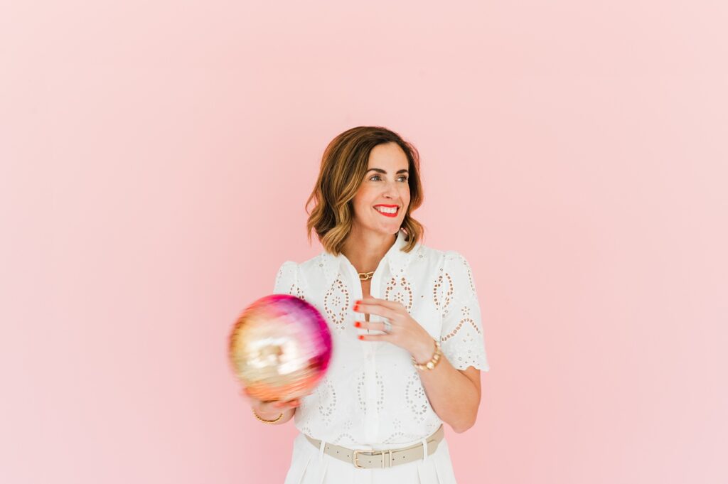 Brand photo of woman smiling against pink background