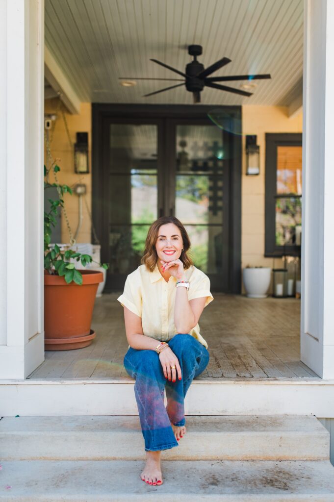 Brand photo of woman sitting on back porch