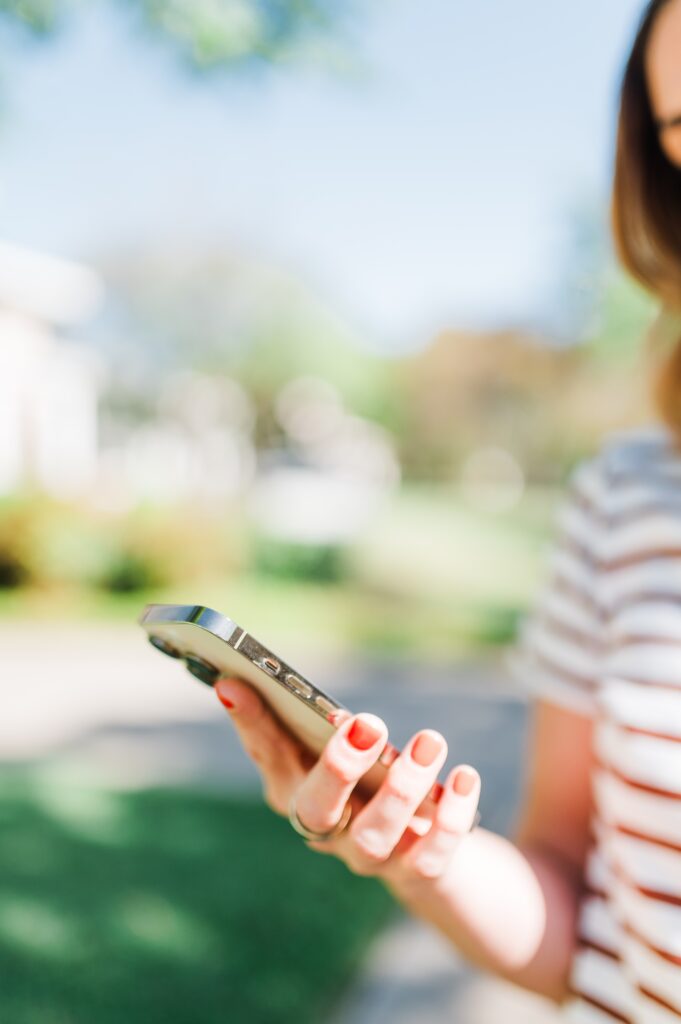 Brand photo of woman holding a phone
