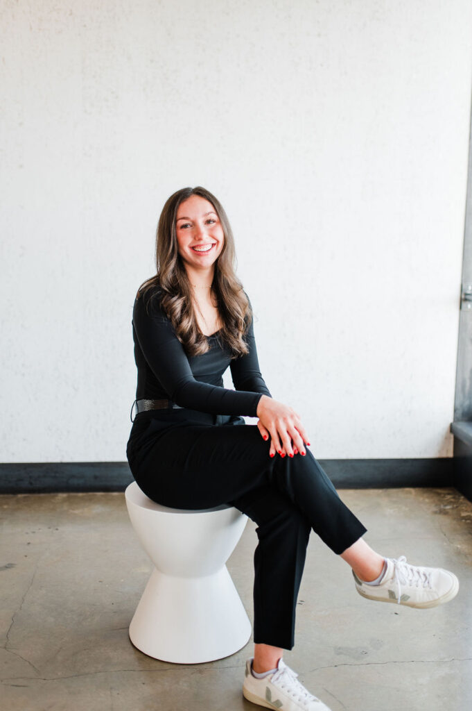 Brand photo of a wedding planner looking and smiling at the camera