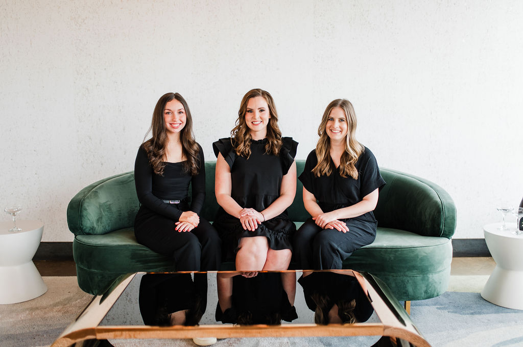 brand photo of 3 wedding planners sitting on a couch together