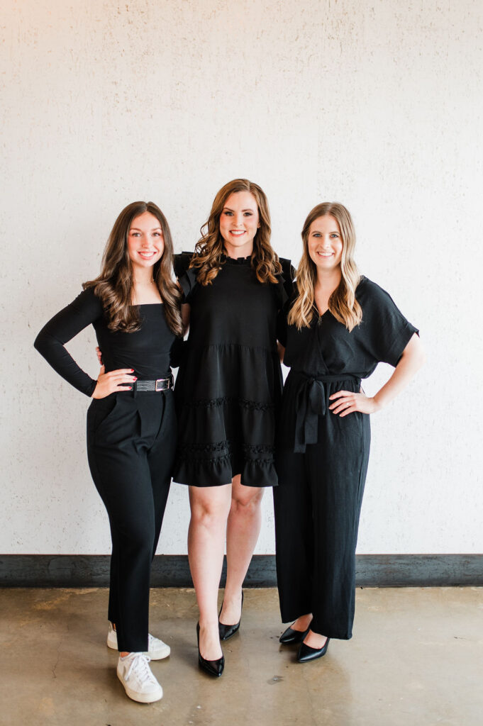 brand photo of 3 wedding planners standing together smiling